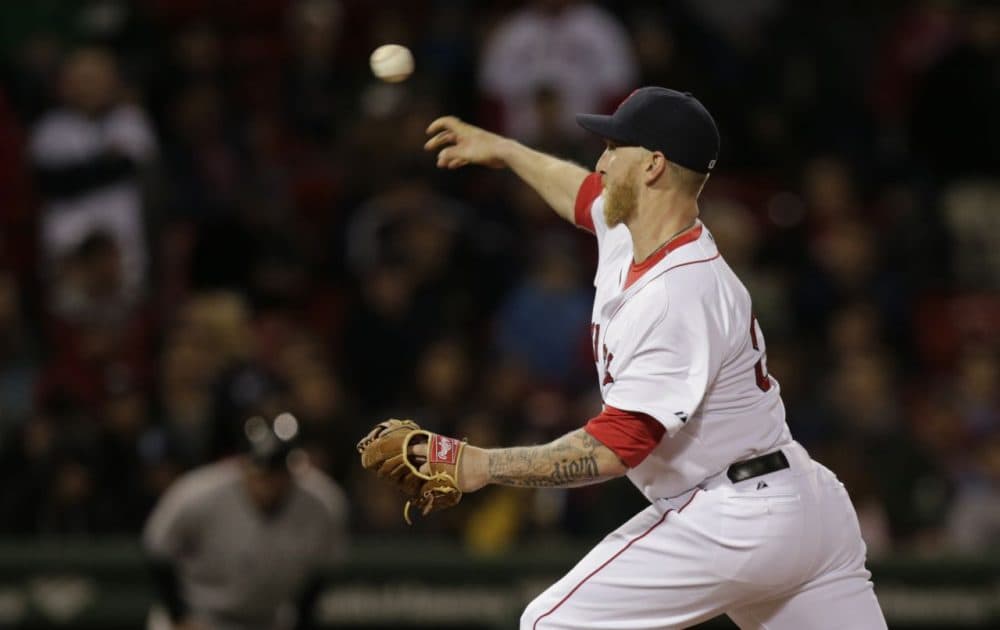 Boston Red Sox left fielder Mike Carp delivers a pitch during the ninth inning.(AP/Charles Krupa)