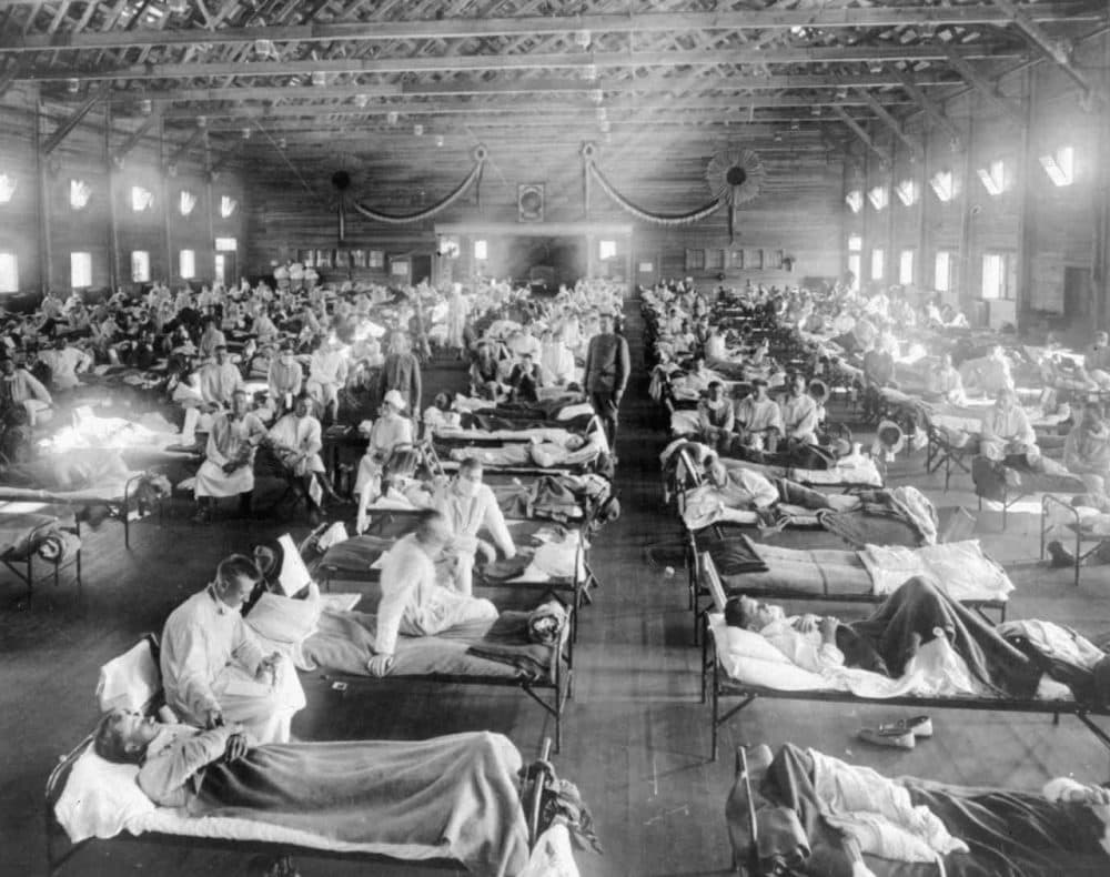 In this 1918 photograph provided by the National Museum of Heath, influenza victims crowd into an emergency hospital at Camp Funston, a subdivision of Fort Riley in Kansas. (AP)