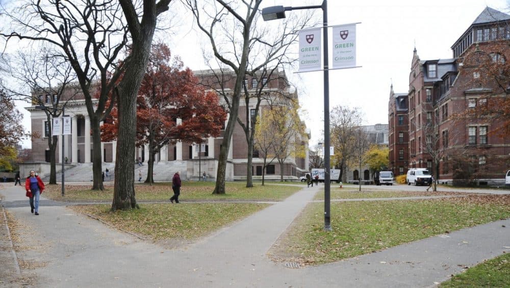 People walk through Harvard Yard at Harvard University. (AP)