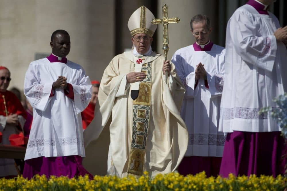 Pope Francis, center, arrives to celebrate an Easter Sunday Mass in St. Peter's Square at the Vatican Sunday. (Andrew Medichini/AP)