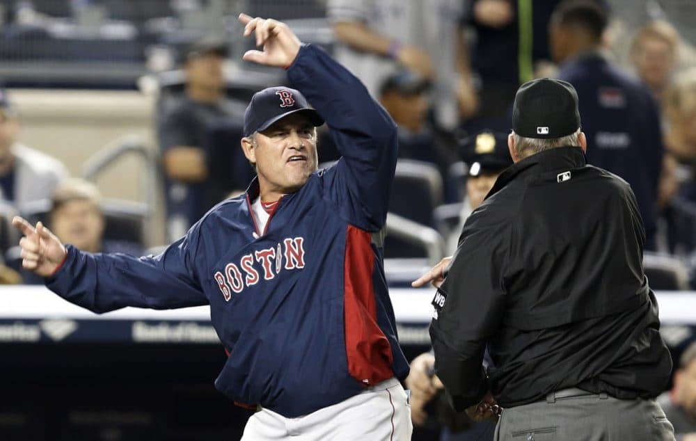 Boston Red Sox manager John Farrell gestures after was was ejected from the game by first base umpire Bob Davidson after Farrell objected to MLB's ruling of an overturned, fourth-inning, force out at first base in a baseball game against the New York Yankees at Yankee Stadium in New York, Sunday, April 13, 2014. The Yankees Brian McCann scored on the play. (AP)