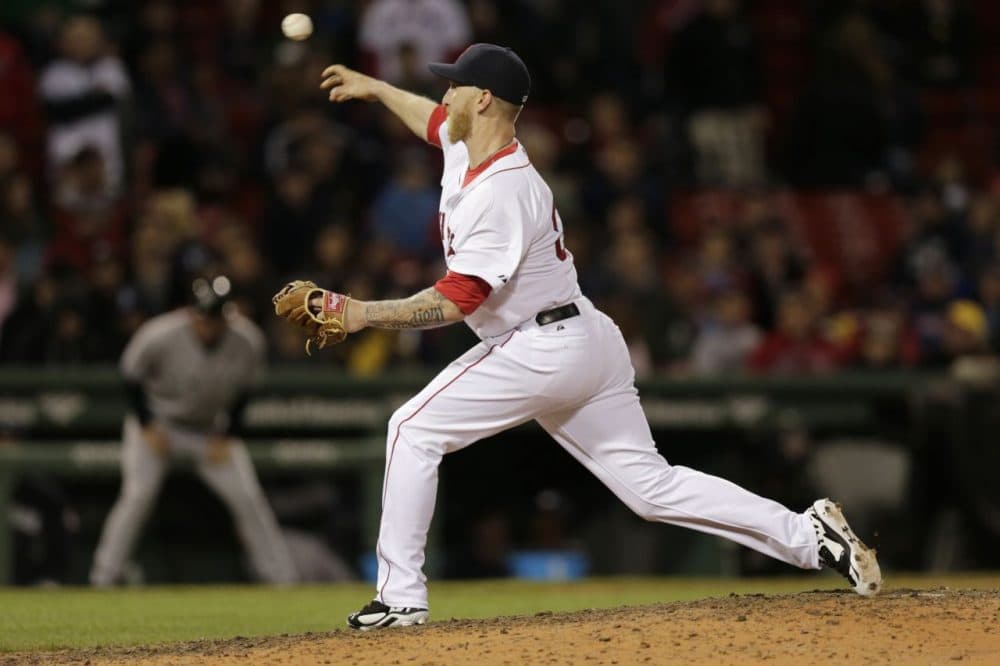 Boston Red Sox's Mike Carp delivers a pitch during the ninth inning of a baseball game against the New York Yankees, Thursday, April 24, 2014, in Boston. (Charles Krupa/AP)