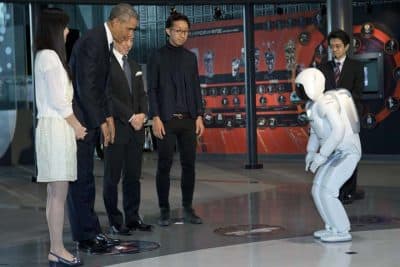 President Barack Obama and ASIMO, an acronym for Advanced Step in Innovative MObility, bow to each other during a youth science event at the National Museum of Emerging Science and Innovation, known as the Miraikan, in Tokyo, Thursday, April 24, 2014. (AP)