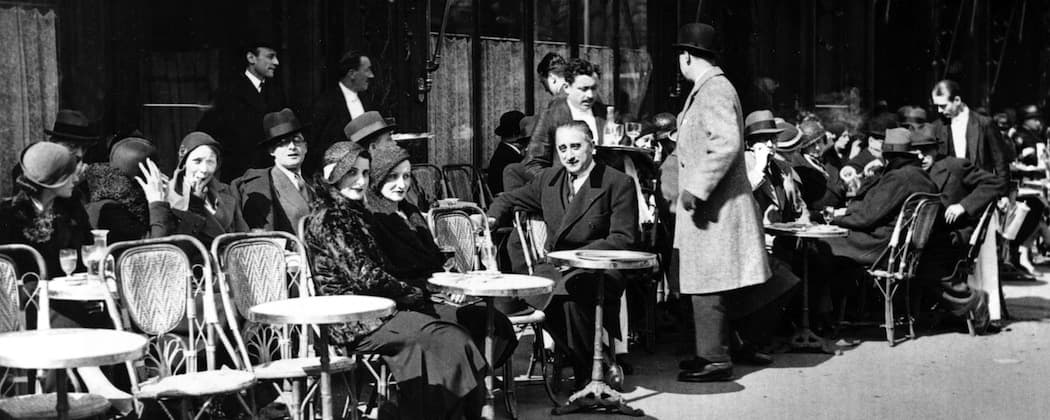 Patrons enjoy the sun outside Weber's Cafe at Rue Royale, around Eastertide in Paris, April 6, 1932.  (AP)