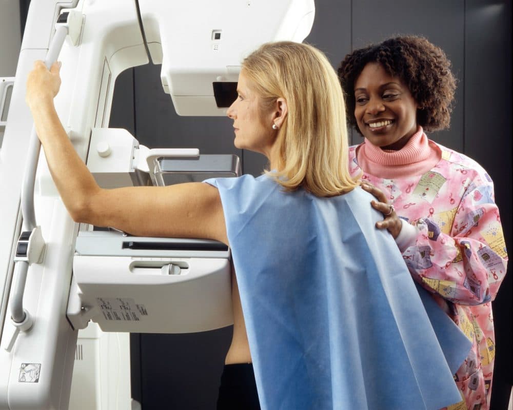 A woman receives a mammogram. (Wikimedia Commons)