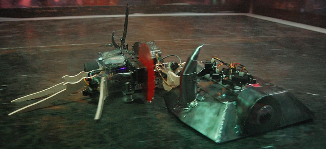 The Plasma Apocalypse robot, with its spinning saw blade (left), clashes with the horned robot constructed by the Somervillians team. (Greg Cook)