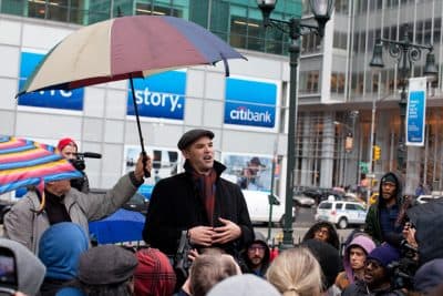 In this file photo, author and journalist Matt Taibbi speaks to a crowd of Occupy Wall Street protestors after a march on the offices of pharmaceutical giant Pfizer, Wednesday, Feb. 29, 2012, in New York. There was a heavy police presence around the 42nd Street area as the demonstration began Wednesday morning outside. (AP)