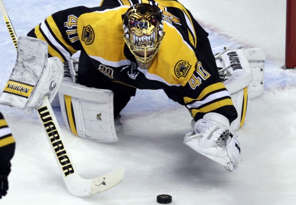 Bruins goalie Tuukka Rask pounces on a loose puck during the second period. (Charles Krupa/AP)