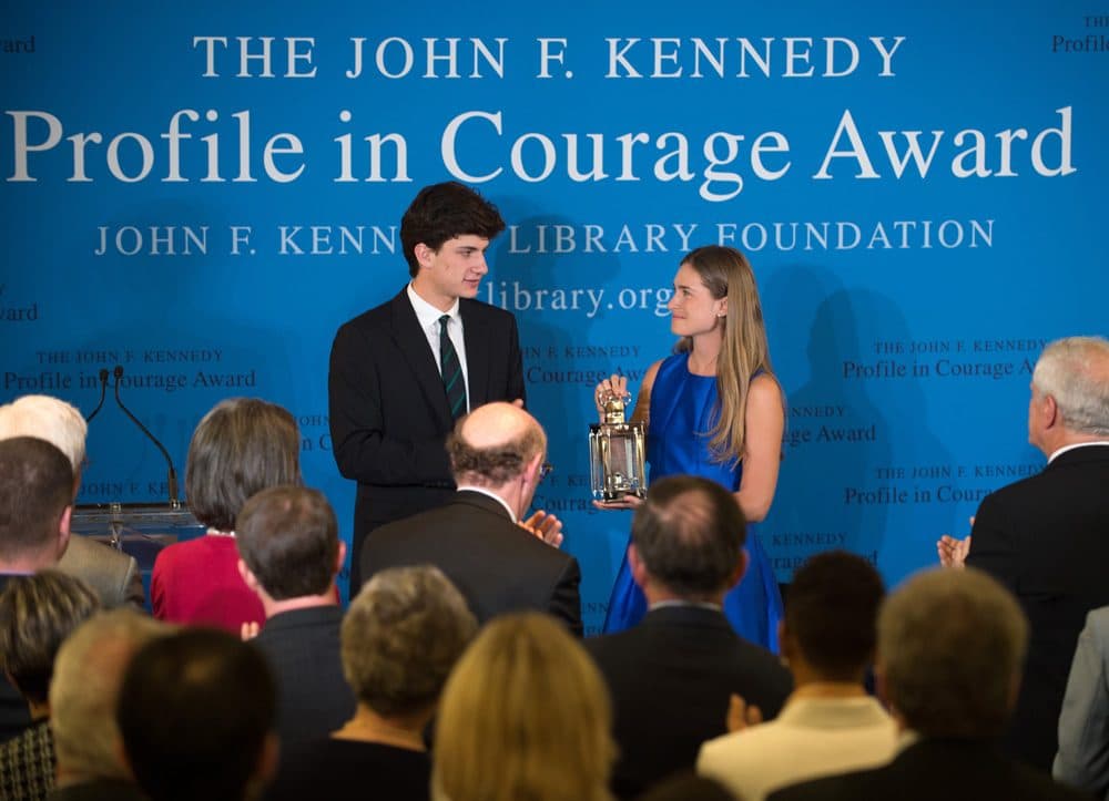 Lauren Bush Lauren, right, granddaughter of former President George H.W. Bush, accepts the 2014 John F. Kennedy Profile in Courage Award on behalf of her grandfather from Jack Schlossberg, left, grandson of President John F. Kennedy, during a ceremony at the John F. Kennedy Library and Museum, Sunday in Boston. (Gretchen Ertl/AP)