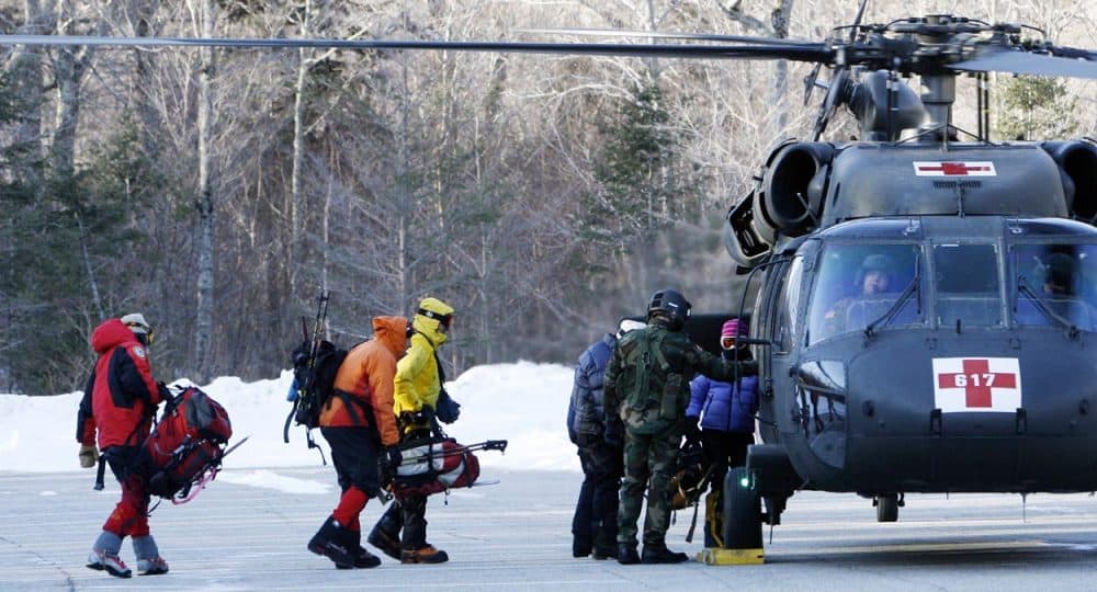 In this Jan. 22, 2007 file photo, a search-and-rescue team boards a helicopter to head to the top of Mount Lafayette to look for a missing hiker in Franconia, N.H.  (Jim Cole/AP)