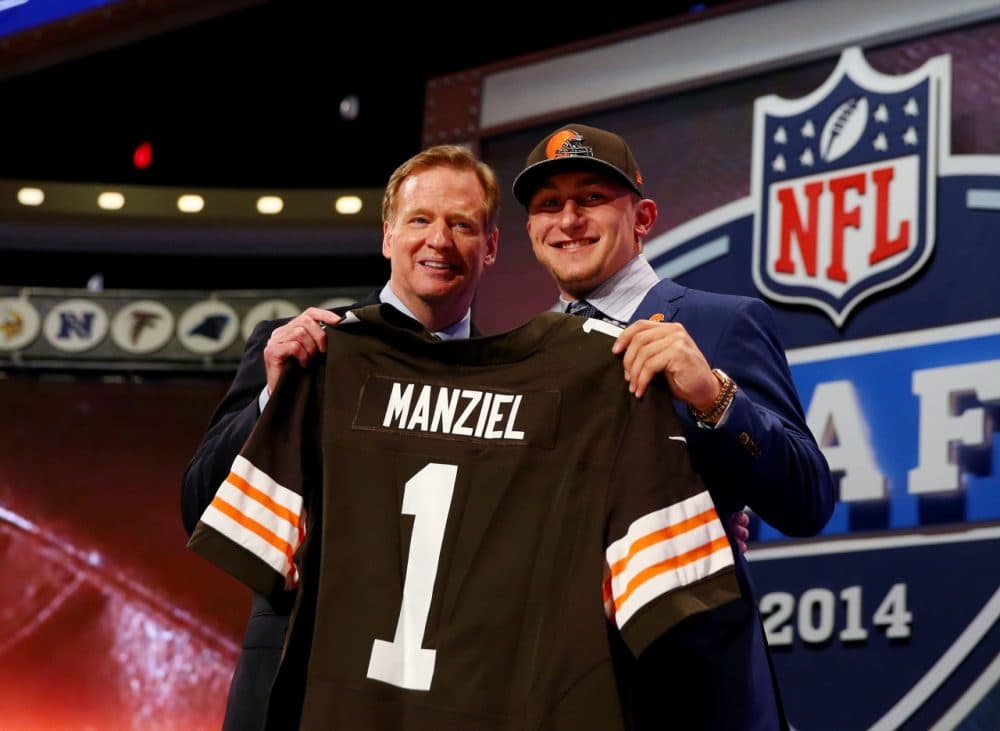 Johnny Manziel poses with Commissioner Goodell after being selected 22 in the NFL Draft. (Elsa/Getty Images)