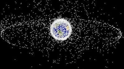 A computer image generated by NASA shows objects orbiting Earth, including those in geosynchronous orbit at a high altitude. The objects are not to scale. (NASA)