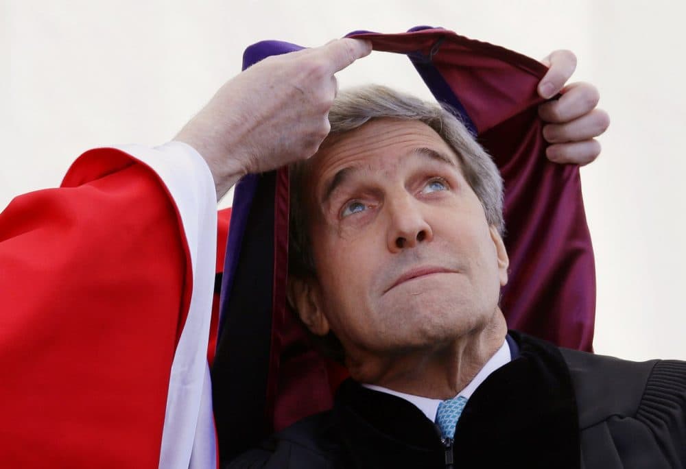 Secretary of State John Kerry is hooded by Boston College President William Leahy during the Boston College commencement ceremony. (Stephan Savoia/AP)
