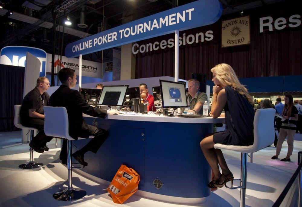 Casino industry representatives play in a mock online tournament during the G2E conference. (Julie Jacobson/AP)