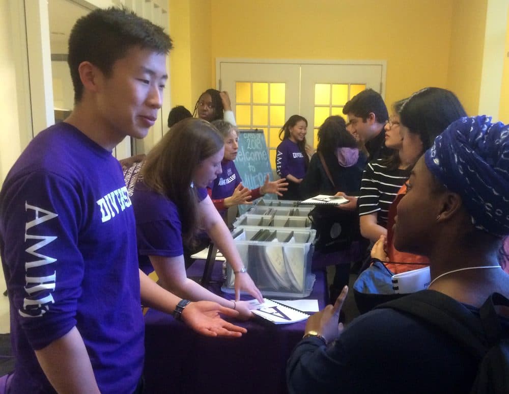 Amherst College diversity interns welcome a group of admitted students to campus on April 12. (Fred Thys/WBUR)