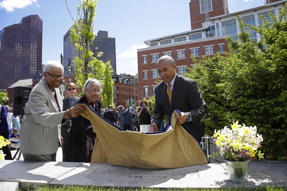 Gov. Deval Patrick helps unveil a plaque during a ceremony to honor Zipporah Potter Atkins, the first African-American to purchase property in Boston. (Stephan Savoia/AP)