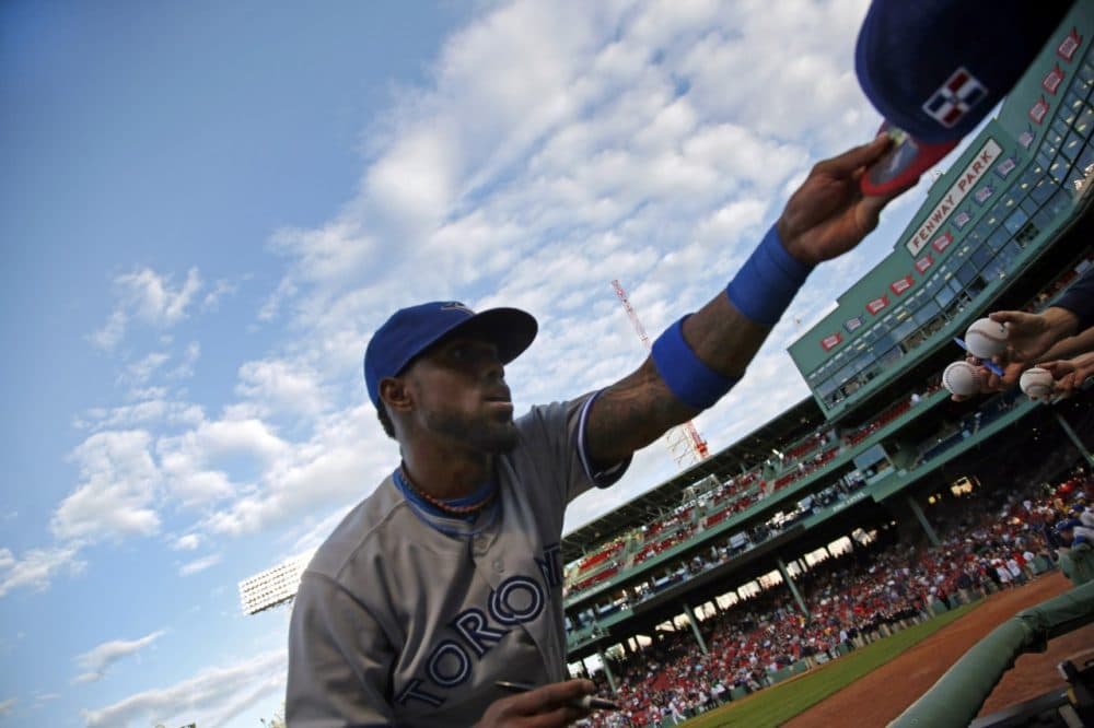 Toronto Blue Jays shortstop Jose Reyes signs autographs prior to a baseball game against the Boston Red Sox at Fenway Park in Boston, Tuesday, May 20, 2014. (AP)