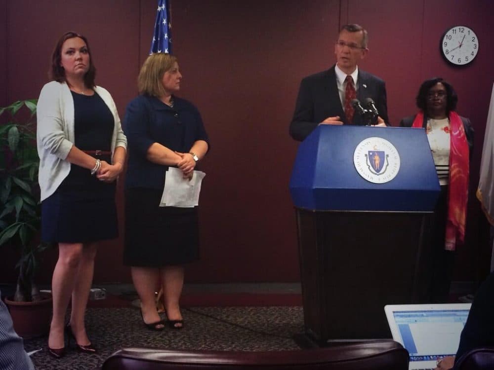 Massachusetts Secretary of Health and Human Services John Polanowicz, joined by the Child Welfare League of America, to present the final report on the Department of Children and Families. (Asma Khalid/WBUR)