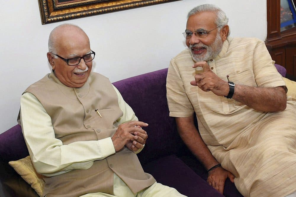 India's next prime minister Narendra Modi, right, talks to Bharatiya Janata Party (BJP) senior leader Lal Krishna Advani at Advani’s residence in New Delhi, India, Sunday, May 18, 2014. Results announced Friday from the weeks-long polls showed that Modi and the Hindu nationalist BJP had won the most decisive election victory India has seen in three decades, sweeping the long-dominant Congress party from power. (AP)