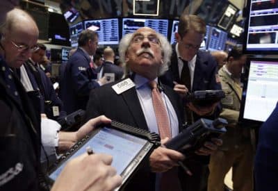 Trader Peter Tuchman, center, works on the floor of the New York Stock Exchange Wednesday, April 30, 2014. The future of many Baby Boomer pension funds is called to question as the stock market continues to hit unprecedented highs. (AP) 