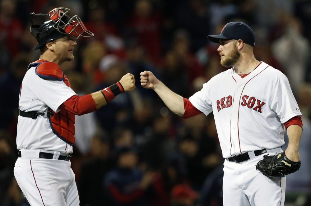 Boston Red Sox's Alex Wilson, right, and A.J. Pierzynski celebrate after they defeated the Tampa Bay Rays 7-1 in a baseball game in Boston, Saturday, May 31, 2014. (Michael Dwyer/AP)