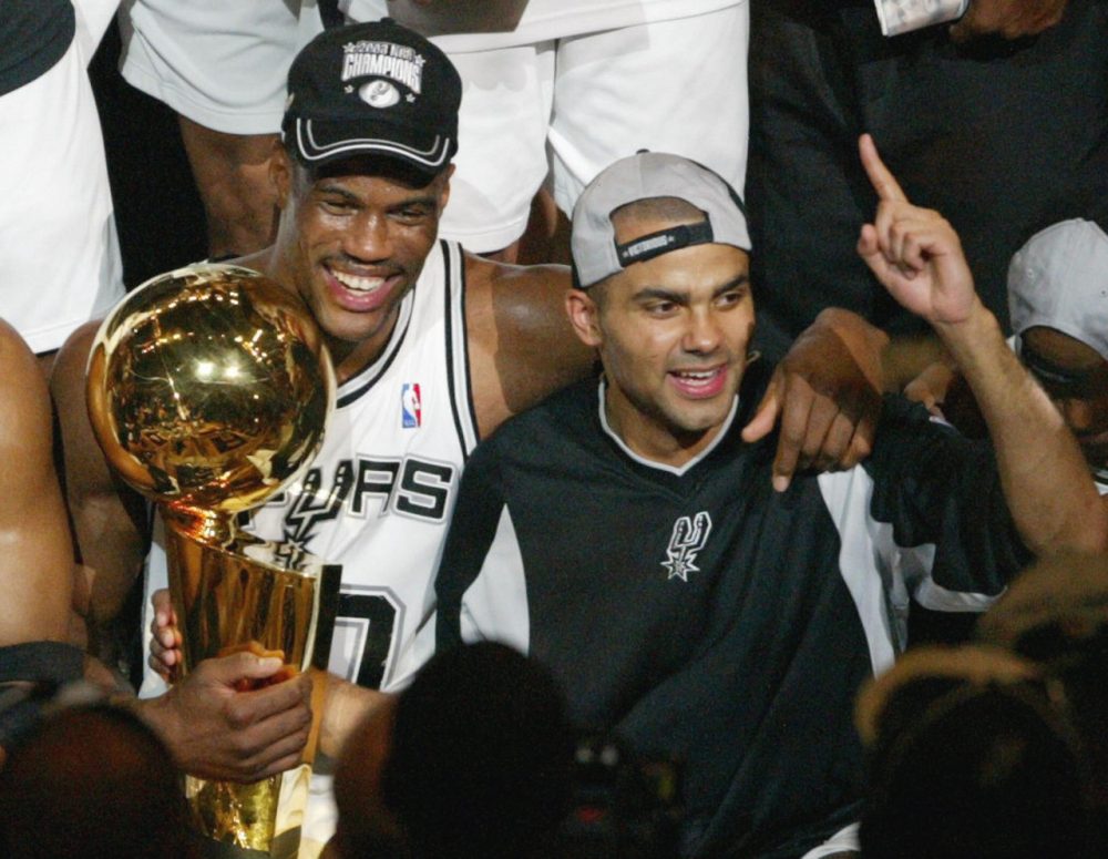 Caption:David Robinson (L) of the San Antonio Spurs and Frenchman Tony Parker celebrate after beating the New Jersey Nets in game six of the NBA Finals at SBC Center in San Antonio, Texas. The Spurs won the game 88-77 to win the best-of-seven game series 4-2. AFP PHOTO/James NIELSEN (Photo credit should read JAMES NIELSEN/AFP/Getty Images)