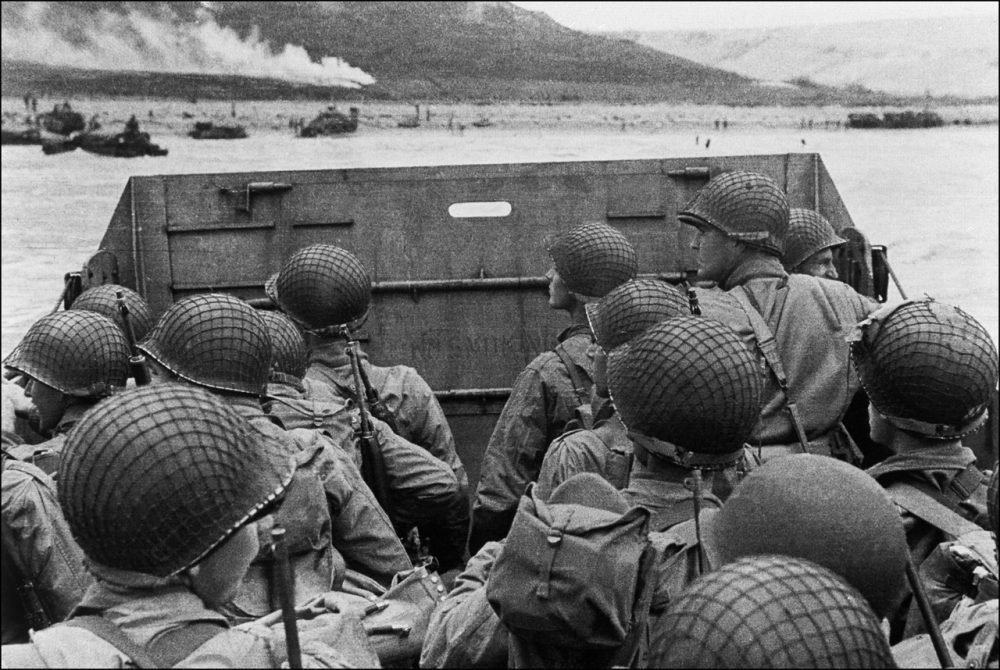 American assault troops in a landing craft huddle behind the shield on June 6, 1944 approaching Utah Beach while Allied forces are storming the Normandy beaches on D-Day. (STF/AFP/Getty Images)