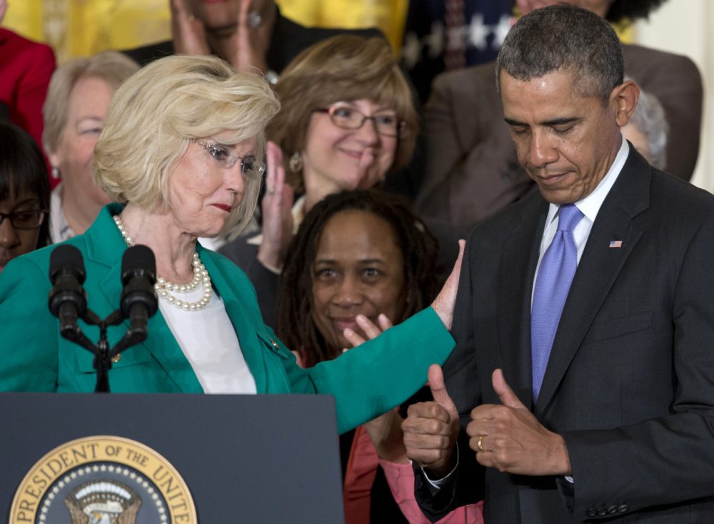 President Barack Obama gives two thumbs as Womens rights activist Lilly Ledbetter acknowledges him during an event marking Equal Pay Day. (Carolyn Kaster/AP)