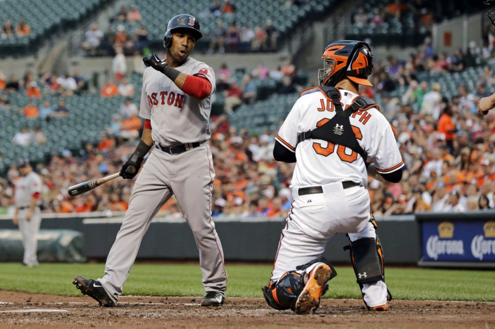 Boston Red Sox's Jonathan Herrera, left, reacts in front of Baltimore Orioles catcher Caleb Joseph after striking out swinging in the third inning. (AP/Patrick Semansky)