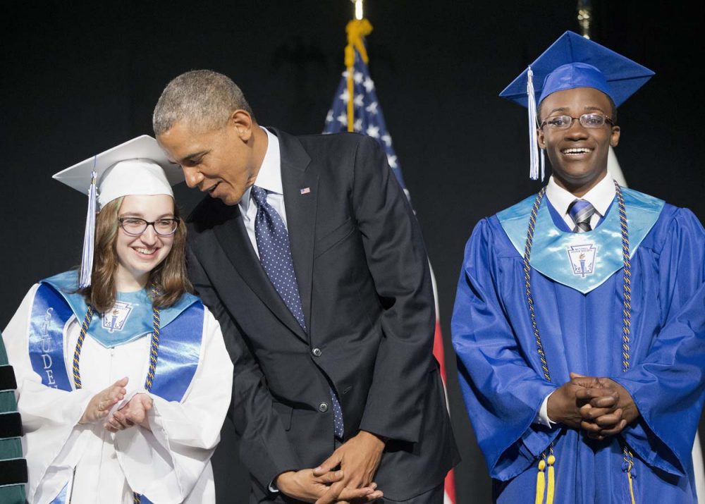 President Obama talks to Worcester Technical High School class valedictorian Naomi Desilets, left, prior to delivering the commencement address. At right, student body president Reginald Sarpong. (Pablo Martinez Monsivais/AP)