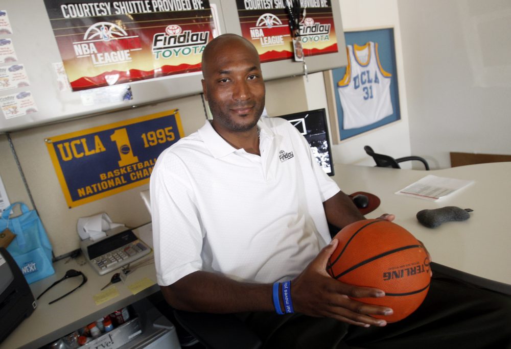 Former UCLA basketball player Ed O'Bannon Jr. sits in his office in Henderson, Nevada on Sept. 18, 2010. He spearheaded a lawsuit arguing that college athletes should be paid for use of their likenesses. (Isaac Brekken/AP)