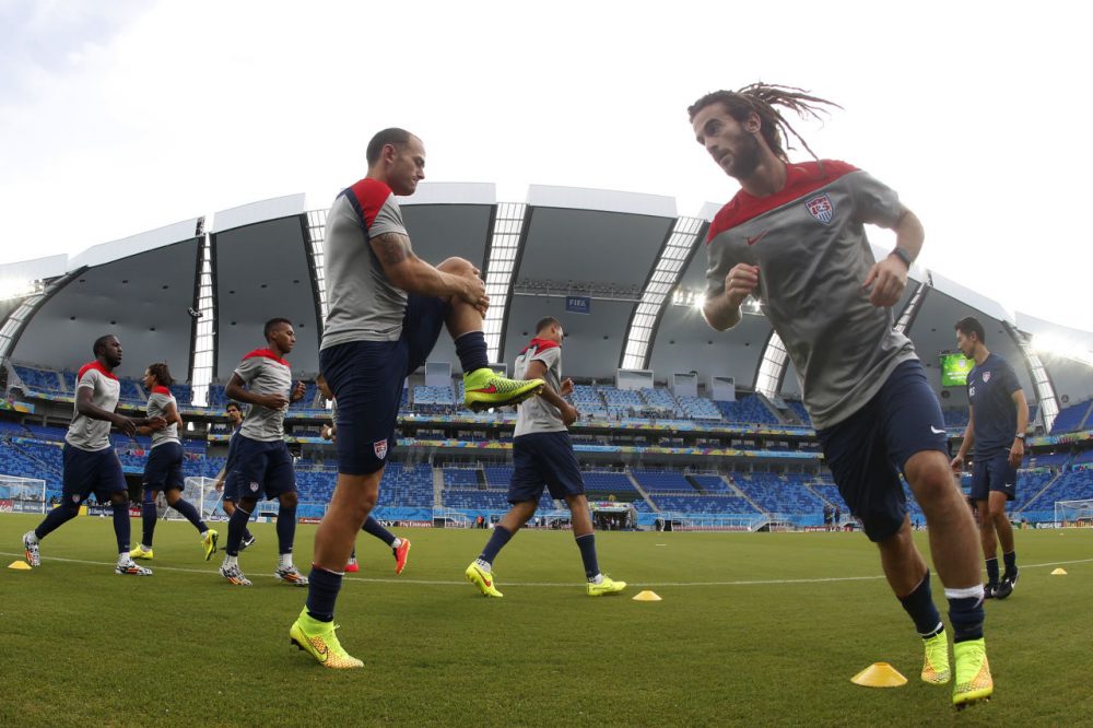 United States players warm up during an official training session on Sunday. (Julio Cortez/AP)