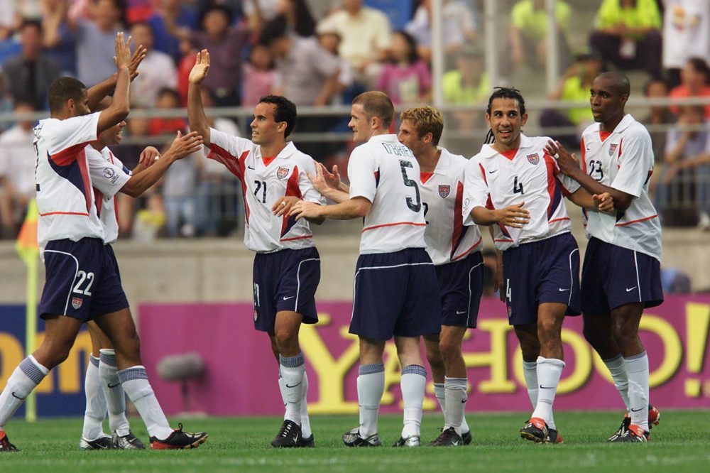 Members of the U.S. 2002 World Cup team celebrate their second goal against Portugal. The U.S. would go on to upset their heavily-favored opponents 3-2. (Brian Bahr/Getty Images)