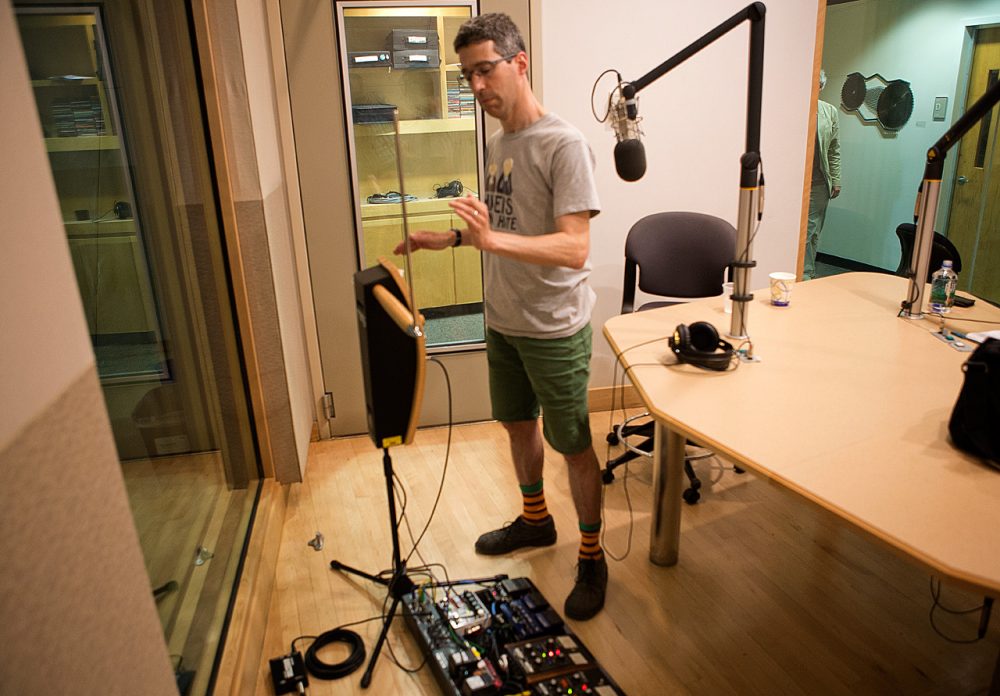 Jon Bernhardt playing the theremin in the WBUR studios. (Jesse Costa/WBUR)