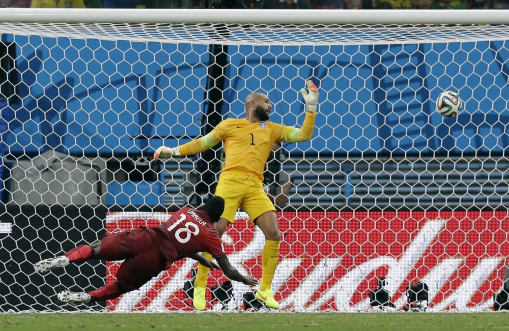 Portugal's Silvestre Varela heads the ball past United States' goalkeeper Tim Howard to score his side's second goal and tie the game 2-2. (Martin Mejia/AP)