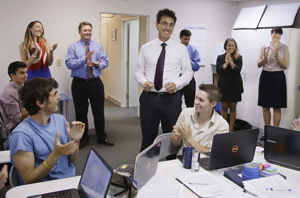 Independent candidate for Massachusetts governor Evan Falchuk informs workers at his campaign headquarters that he has become the first gubernatorial candidate to officially qualify for the November ballot. (Stephan Savoia/AP)