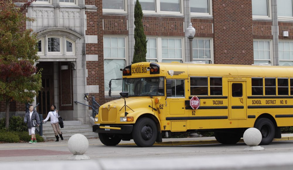 A school bus waits to pick up students at Jason Lee Middle School in Tacoma, Wash. (Ted S. Warren/AP)