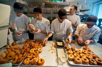 A baking crew makes Cronuts, a croissant-donut hybrid, at the Dominique Ansel Bakery in New York. (AP)