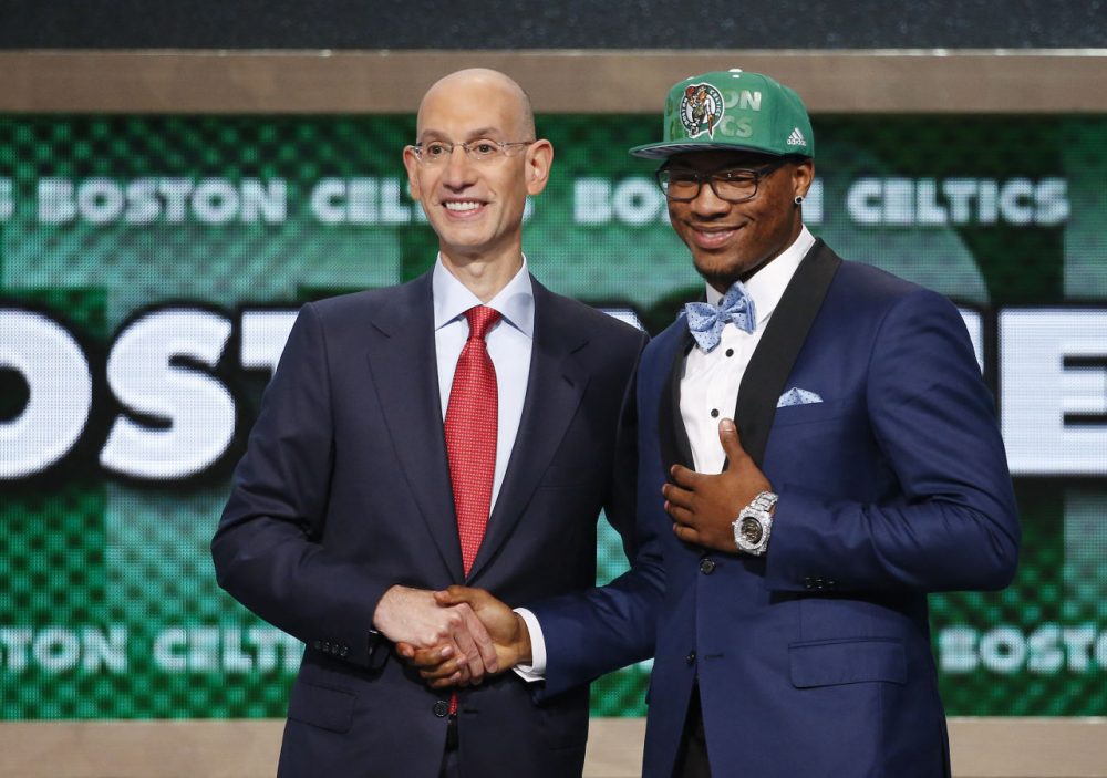 Oklahoma State's Marcus Smart, right, poses for a photo with NBA commissioner Adam Silver after being selected sixth overall by the Boston Celtics during the 2014 NBA draft, Thursday, June 26, 2014, in New York. (Jason DeCrow/AP)