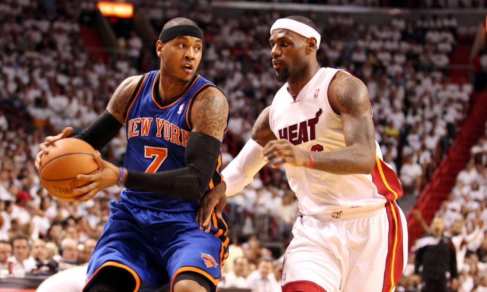 Carmelo Anthony (left) and LeBron James (right) could both be on the move this offseason. (Marc Serota/Getty Images)
