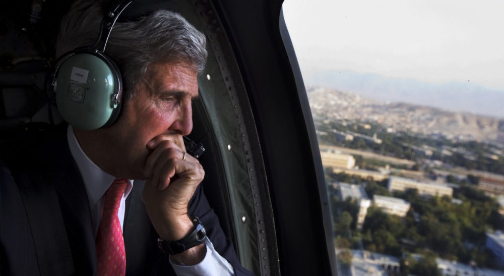Eileen McNamara: U.S. Sec. of State John Kerry seems to have forgotten how he used to feel about dissenters being called traitors. In this Oct. 11, 2013, file photo, Kerry looks out the window en route to the ISAF headquarters after a visit to Kabul, Afghanistan. (Jacquelyn Martin/AP)