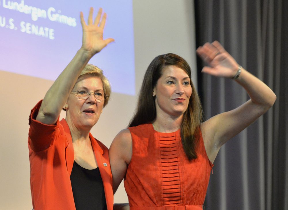 Democratic U.S. Sen. Elizabeth Warren, left, of Massachusetts and Kentucky democratic Senatorial candidate Alison Lundergan Grimes wave to supporters at at rally on Sunday, June 29, 2014 at the University of Louisville in Louisville, Ky. Warren has been canvassing the country following a failed vote in the U.S. Senate that would have allowed some people to refinance their student loan debt to take advantage of lower interest rates. (AP)