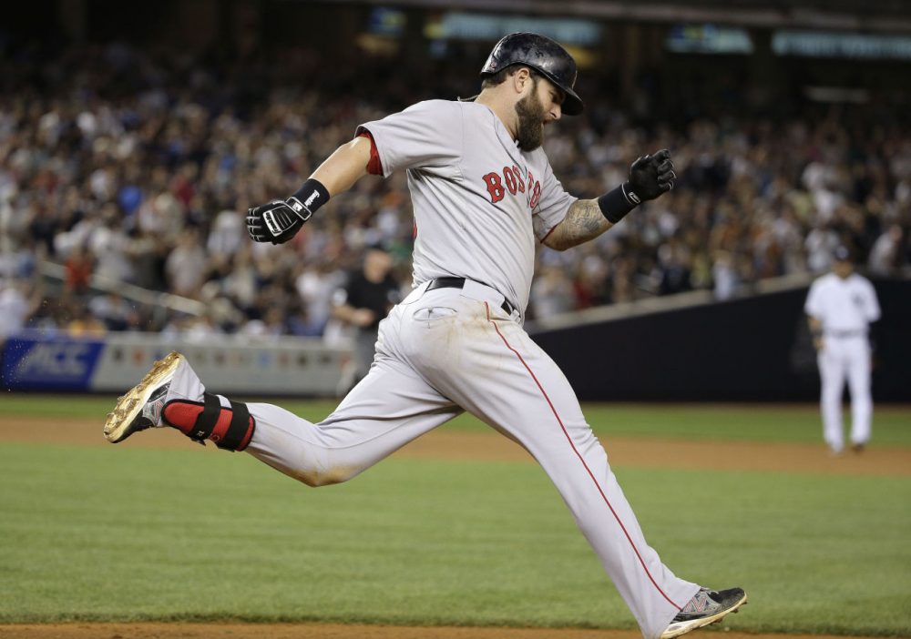 Boston Red Sox's Mike Napoli rounds first base after hitting a solo home run over against the New York Yankees in the ninth inning Saturday. The Red Sox won 2-1. (Julie Jacobson/AP)