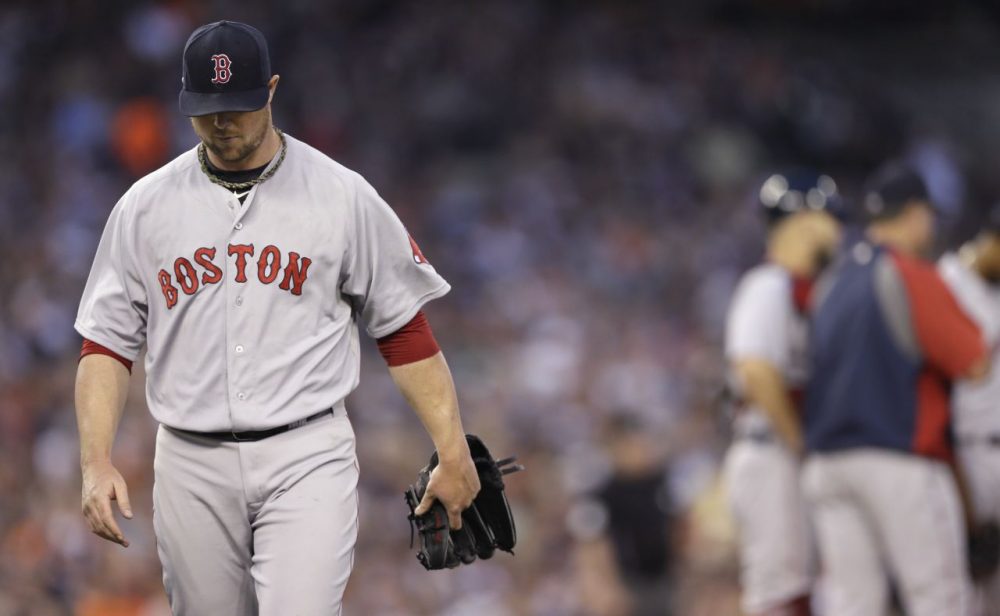 Boston Red Sox starting pitcher Jon Lester leaves after being pulled from the baseball game against the Detroit Tigers during the fifth inning in Detroit, Saturday, June 7, 2014. (Carlos Osorio/AP)