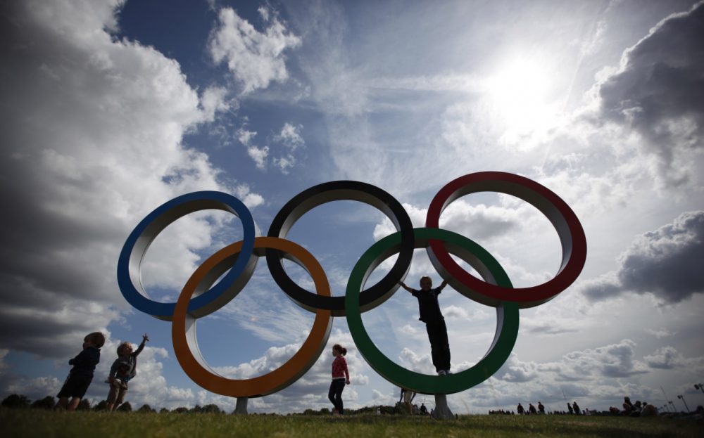 Children play on the Olympic rings in Eton Dorney, England, at the 2012 Summer Olympics. (Natacha Pisarenko/AP)