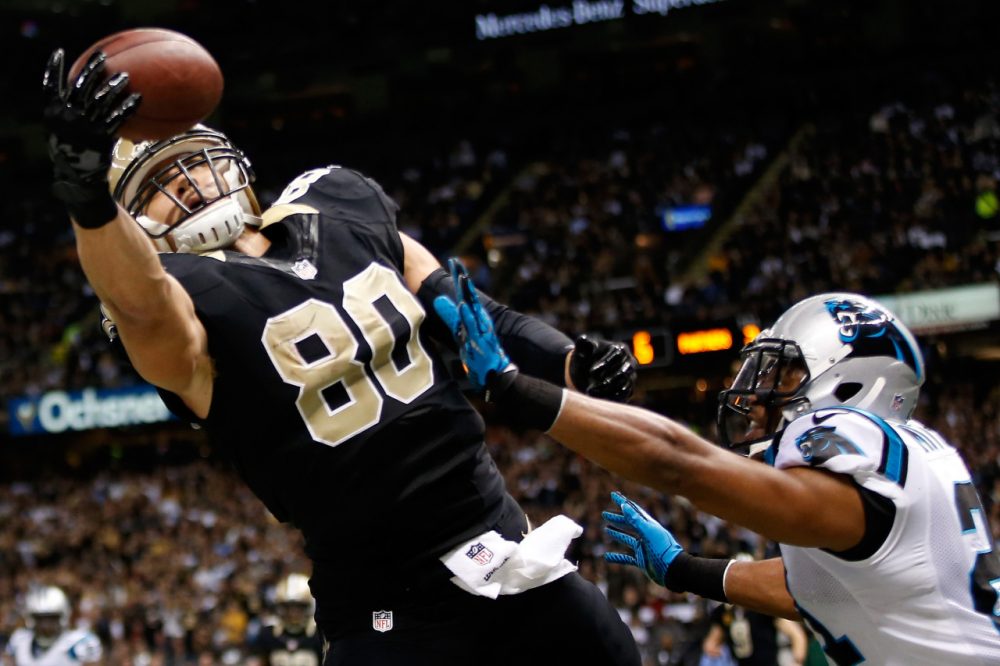 Tight ends like Jimmy Graham (80) receive the ball, but are they wide receivers? An arbitrator said no this week. (Chris Graythen/Getty Images)