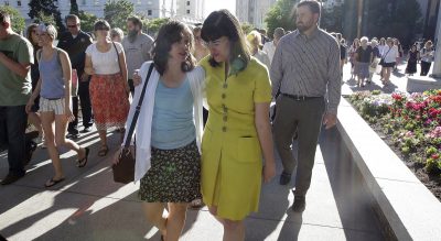 R. B. Scott: &quot;The church is at an important crossroad in its 184-year history.&quot; Pictured: Kate Kelly, right, walks with a supporter after addressing her supporters at the Church Office Building of the Church of Jesus Christ of Latter-day Saints during a vigil Sunday, June 22, 2014, in Salt Lake City. Kelly was excommunicated from The Church of Jesus Christ of Latter-day Saints in June. (Rick Bowmer/AP)