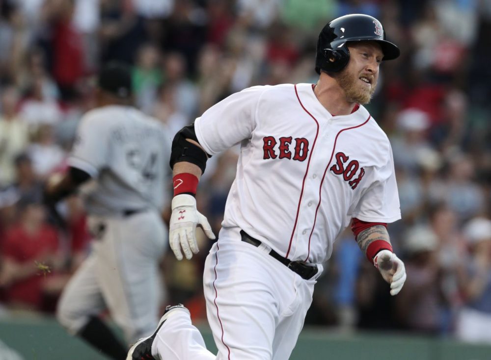Boston Red Sox pinch hitter Mike Carp rounds first on his walk-off RBI single, breaking a 3-3 tie, against the Chicago White Sox at Fenway Park in Boston Thursday. The Red Sox defeated the White Sox 4-3 in 10 innings. (Charles Krupa/AP)
