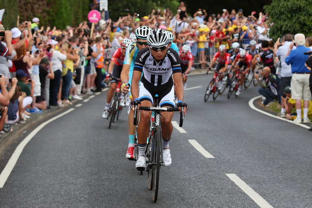 JI Cheng of China and Giant -Shimano leads the peloton during the third stage of the 2014 Tour de France, a 155km stage between Cambridge and London, on July 7, 2014 in London, England. (Photo by Bryn Lennon/Getty Images)