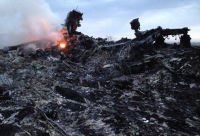 Smoke rises up at a crash site of a passenger plane, near the village of Grabovo, Ukraine, Thursday, July 17, 2014. (Dmitry Lovetsky/AP)